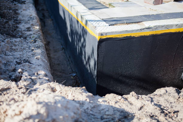 Professional Waterproofing technician working in Port Washington, NY